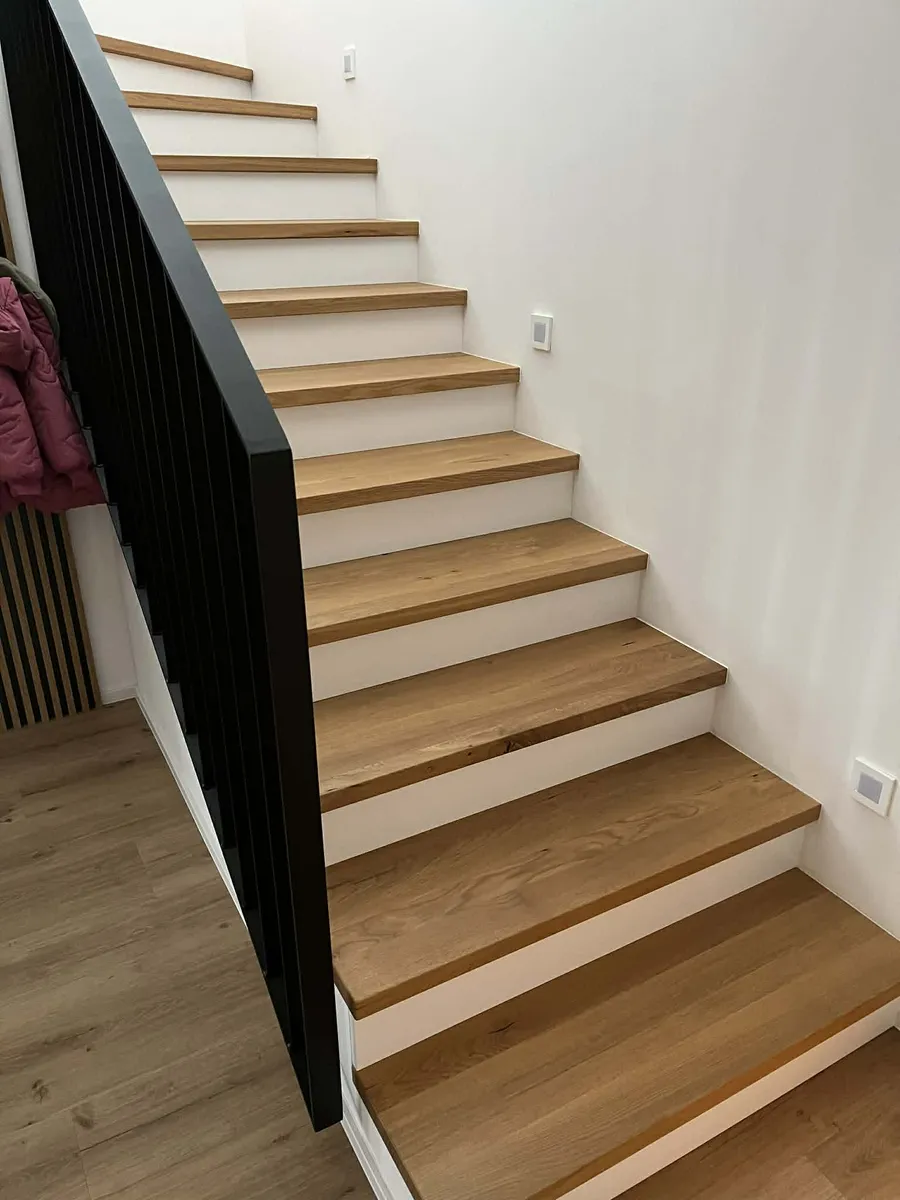 Oak stair treads with black metal railing