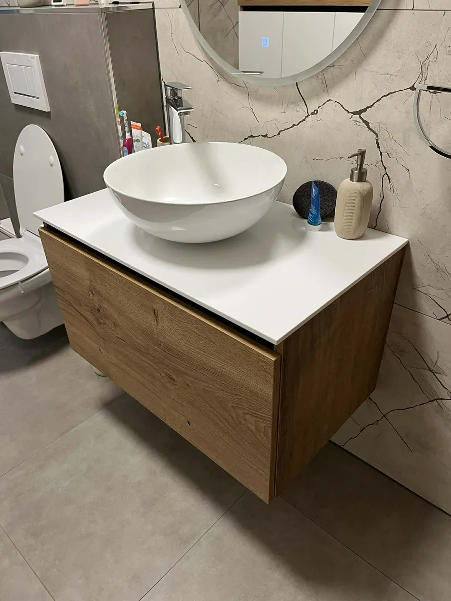 Bathroom vanity with oak front and vessel sink